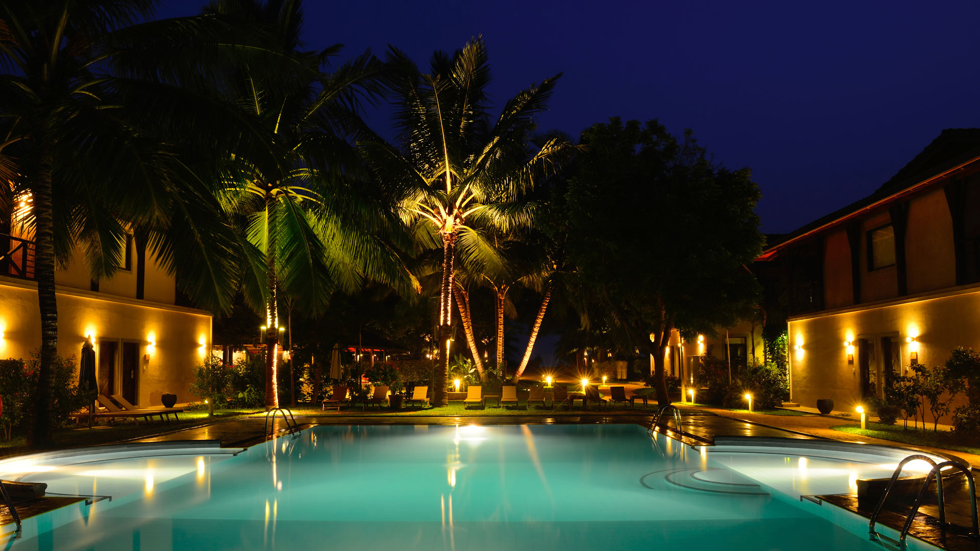 Image of a pool with outdoor lighting